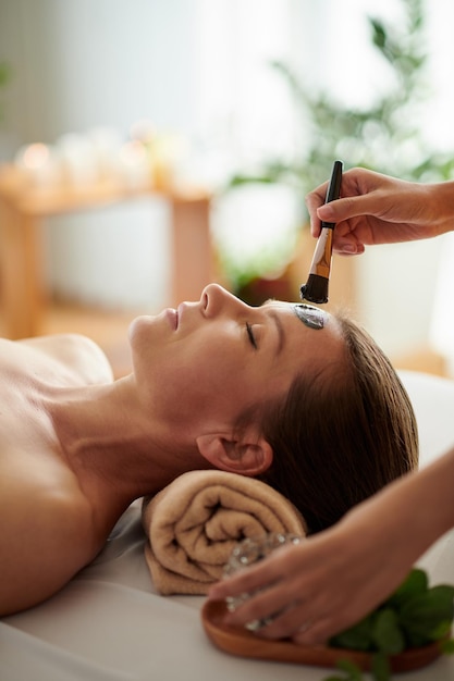 Esthetician Applying Clay Mask