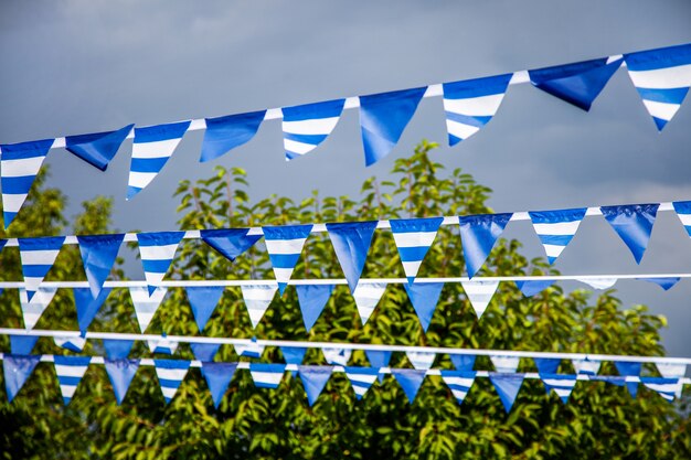 Estival flag line with blue sky in. flag hanging on blue sky for fun fiesta party event