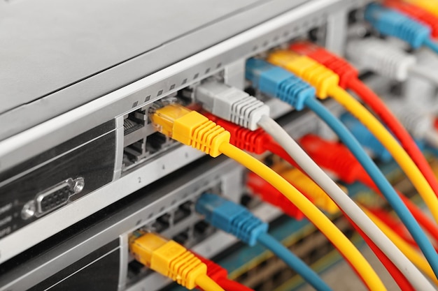 ethernet cables connected to network switch close up