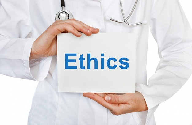 Ethics card in hands of Medical Doctor