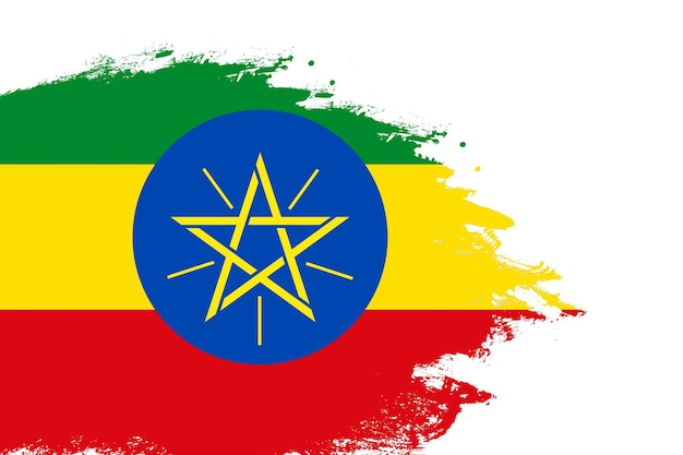 Ethiopia flag on a stained stroke brush painted isolated white background with copy space