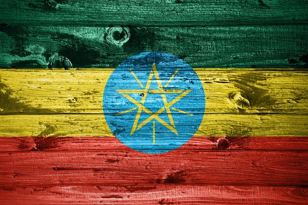 Ethiopia flag on wooden planks background