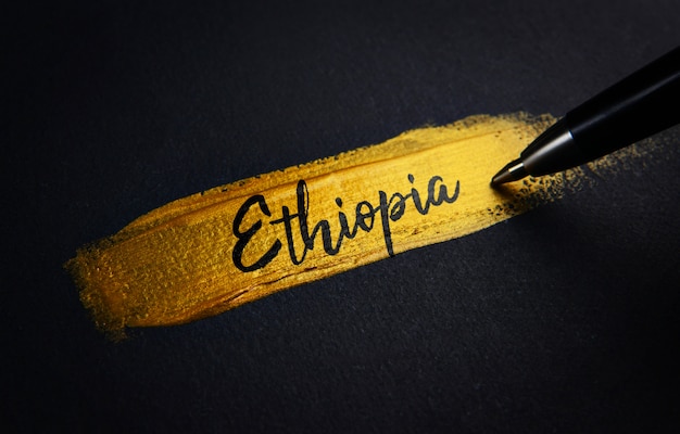 Ethiopia Handwriting Text on Golden Paint Brush Stroke