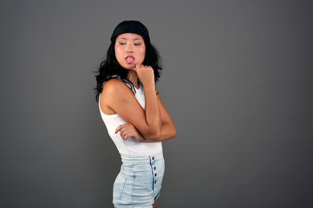 Ethnic asian woman in urban attire defiant attitude