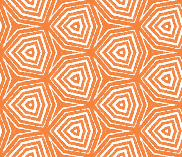 エスニック手描きパターン。オレンジ色の対称的な万華鏡の背景。テキスタイル対応の圧倒的なプリント、水着生地、壁紙、ラッピング。サマードレスエスニック手描きタイル。