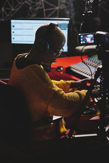 Ethnic lady working at radio station