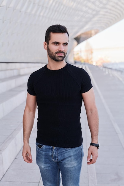 Ethnic male on steps under roof