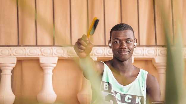 Ethnic men with hairbrush looking at camera