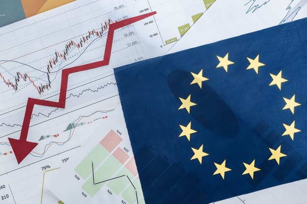 EU flag, downward falling arrow, graphs and charts. Global economic crisis