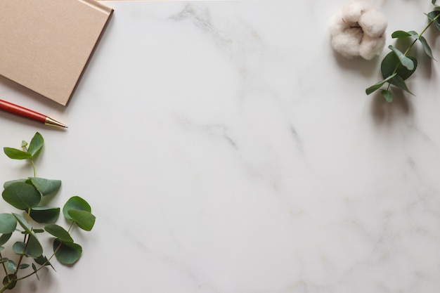 Flat lay with sketchbook, and office supplies on white background. Top view  mockup Stock Photo by ©woodpencil 184081728