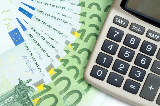 Euro banknotes and calculator abstract background