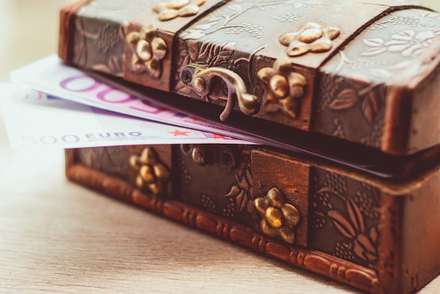 Euro banknotes in a casket