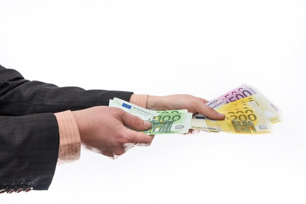 Euro banknotes in fan in male hand