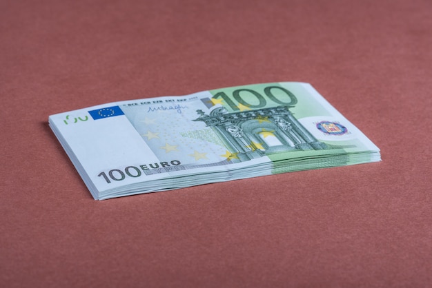 Euro cash on a pink and brown surface