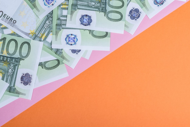 Euro cash on a pink and orange.