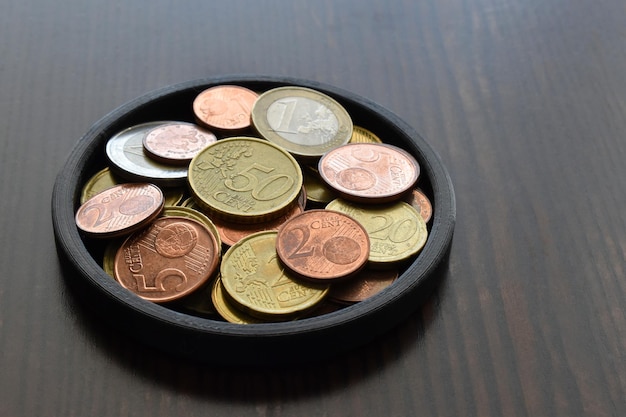 Euro cent coins on wood table