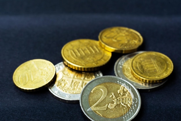 Euro close up photo macro coins soft focus dark background