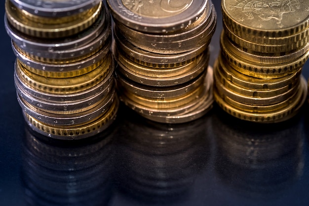 Euro coin isolated on black , close up