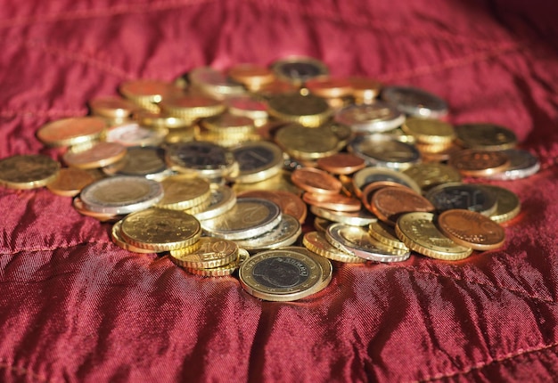 Euro coins European Union over red velvet background