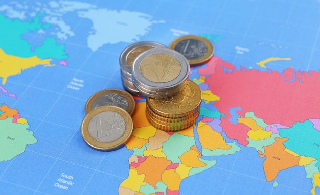 Photo euro coins on map background