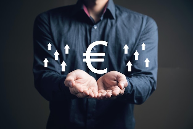 Euro icon with up arrow Rate growth Man holding in his hand