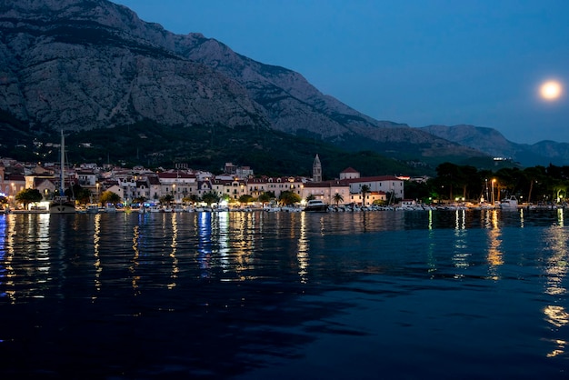 Europe. Croatia. Panorama of the old town of Makarska and the city at night