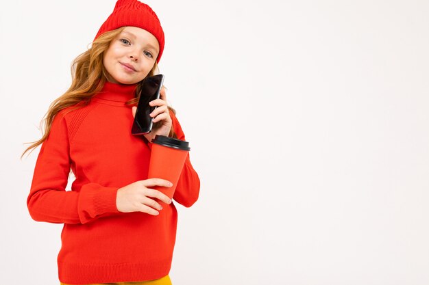 European attractive girl holding a phone in his hands