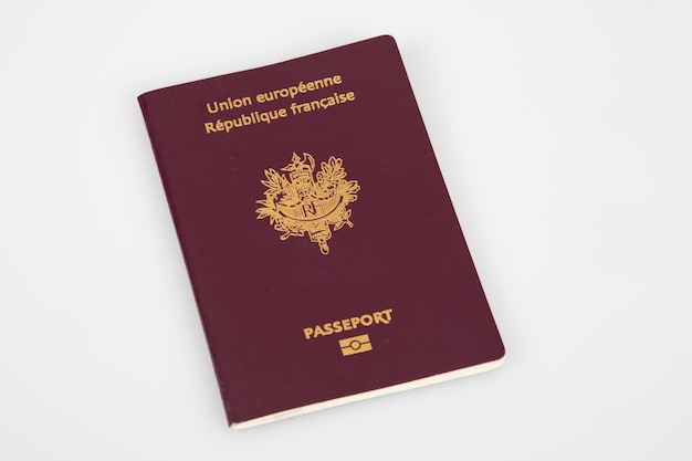 Photo european biometric passport for the french republic on white grey background