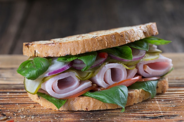 European fast food sandwich with meat and vegetables, quick snack