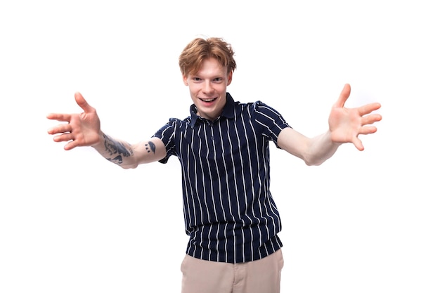 European hipster young blond man in tshirt on white background