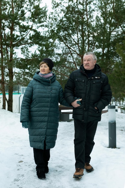 European mature family went out to get some fresh air in the winter park