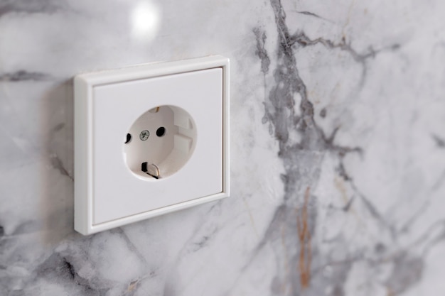 European socket on grey marble