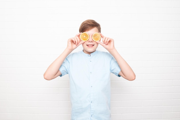 European teenager  with oranges