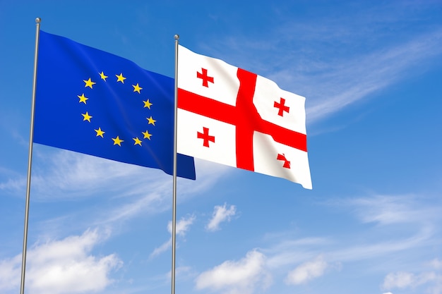 European Union and Georgia flags over blue sky background. 3D illustration