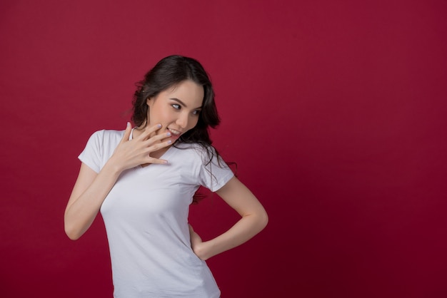 european woman on red background, portrait girl