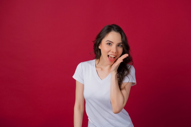 european woman on red wall