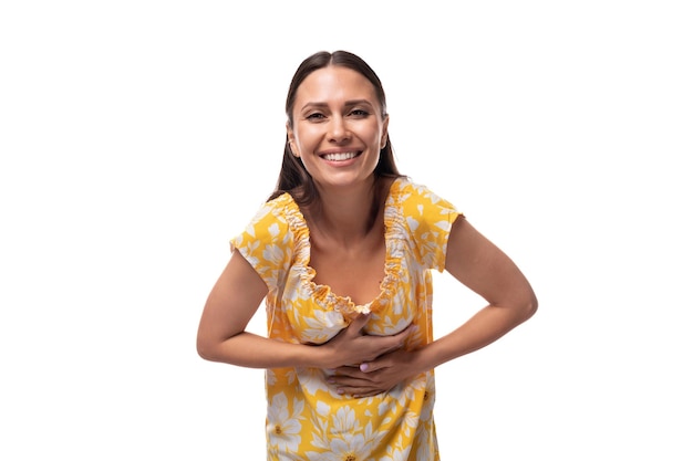 European woman with straight flowing black hair rejoices at good luck