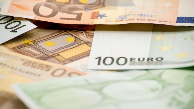 Euros bills of different values. A euro bill of one hundred. Cash money background. Real banknotes hundred. Good earnings. Issuing the salary. Credit percent