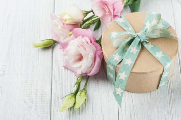 Photo eustoma flower and gift box with star green ribbon