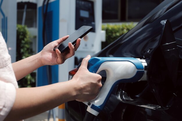 EV charging station for electric car in concept of green energy and eco power produced from sustainable source to supply to charger station in order to reduce CO2 emission