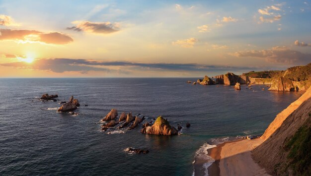 Evening Atlantic ocean coastline landscape Beautiful Gueirua beach with sharp islets Asturias Spain