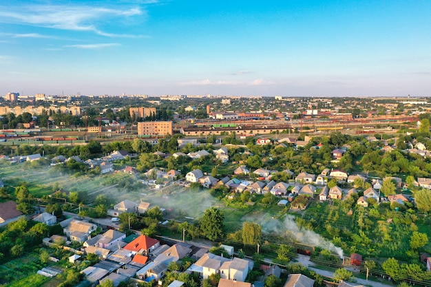 Evening city under beautiful blue sky with clouds