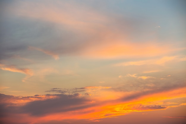 evening sky with clouds and rays of the sun background