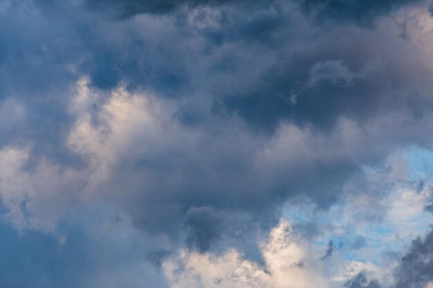 Evening summer clouds background in different contrast shades