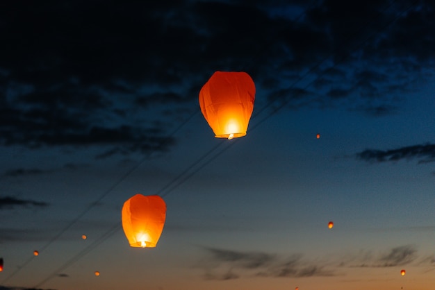 In the evening, at sunset, people with their relatives and friends launch traditional lanterns. Tradition and travel.