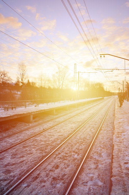 Evening winter landscape with the railway station