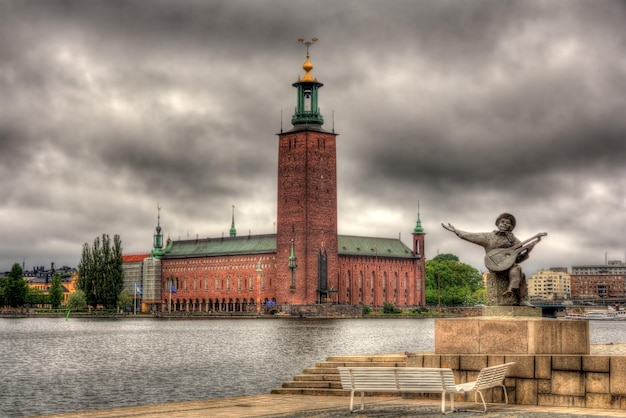 Photo evert taube monument and stockholm city hall sweden