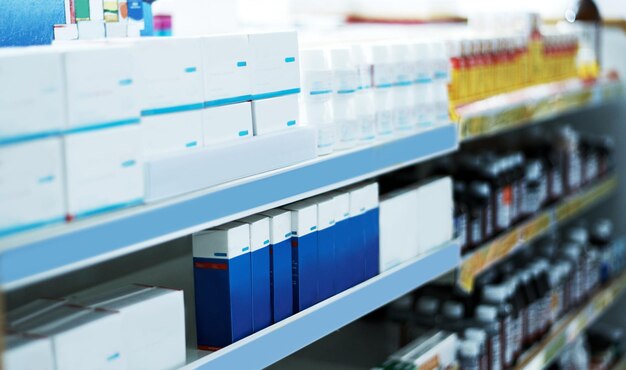Photo every brand to get you feeling better shot of shelves stocked with various medicinal products in a pharmacy