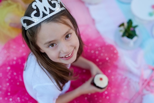 Photo every little girl should feel like a princess portrait of a little girl dressed up as a princess having a picnic outside