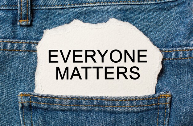 Photo everyone matters on torn paper surface